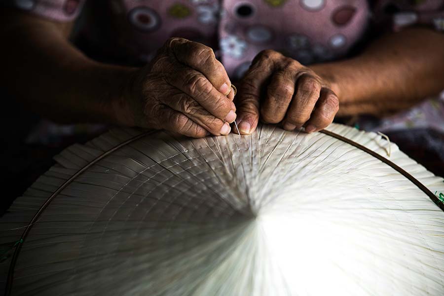 conical hat making tradition handicraft photo by rehahn in hoi an vietnam
